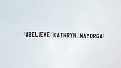 The banner, saying Believe Kathryn Mayorga, was flown over Manchester United's Old Trafford stadium.