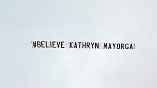 The banner, saying Believe Kathryn Mayorga, was flown over Manchester United's Old Trafford stadium.