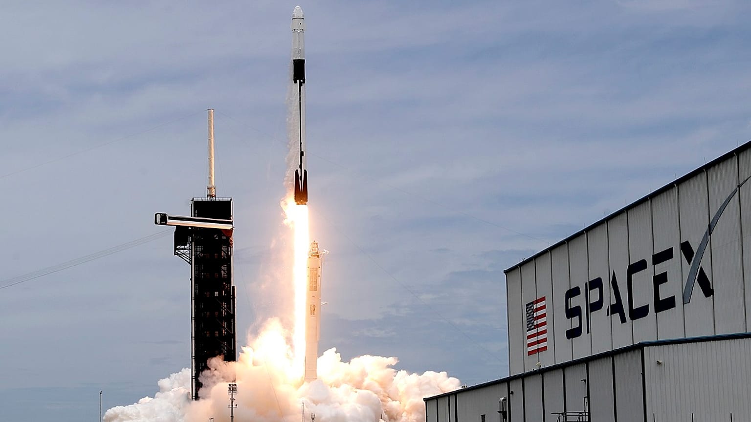 A SpaceX Falcon 9 rocket with a Dragon 2 spacecraft lifts off on pad 39A at the Kennedy Space Center for a re-supply mission to the International Space Station from Cape Canav