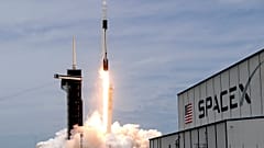 A SpaceX Falcon 9 rocket with a Dragon 2 spacecraft lifts off on pad 39A at the Kennedy Space Center for a re-supply mission to the International Space Station from Cape Canav