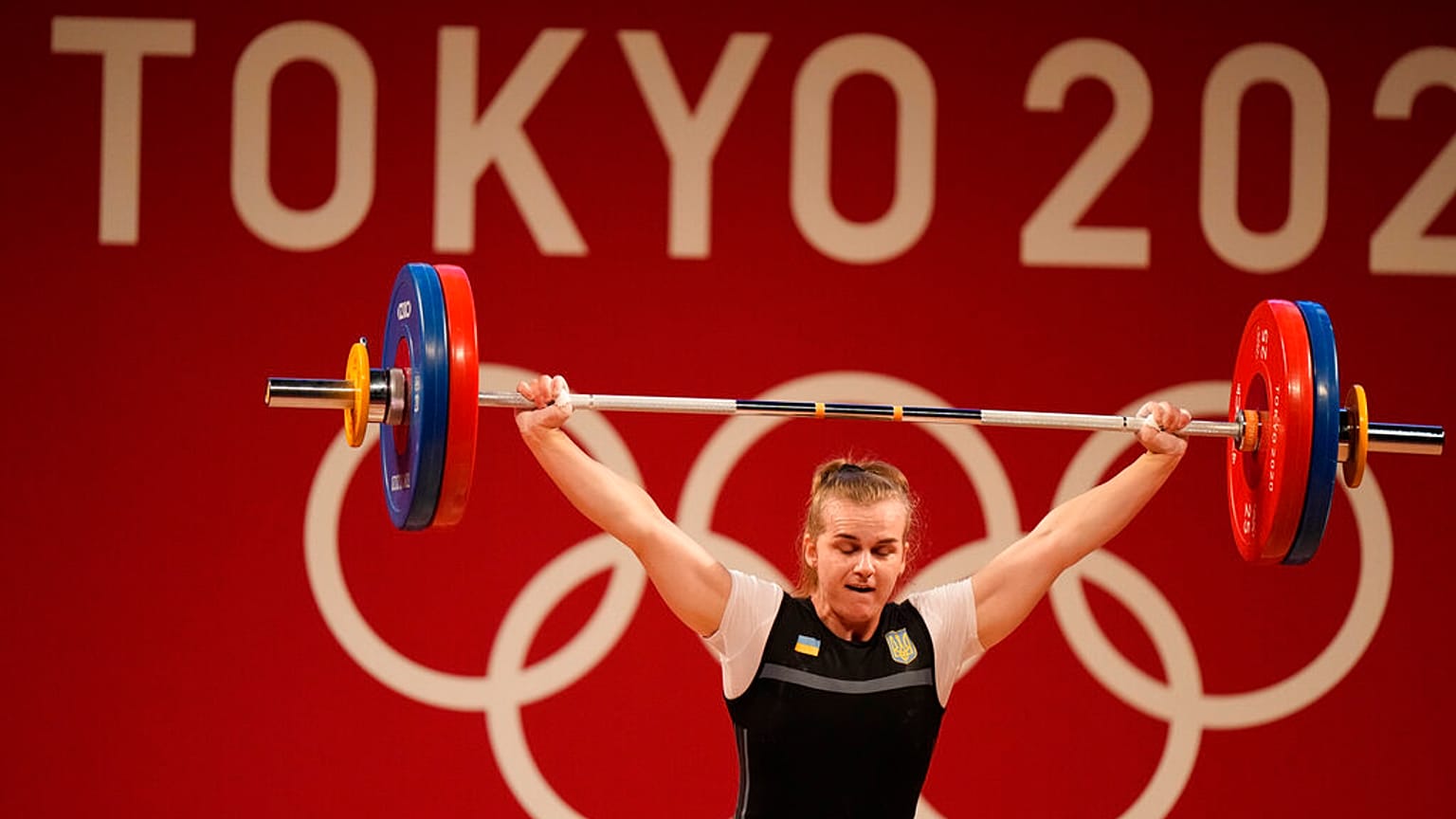 Iryna Dekha of Ukraine competes in the women's 76kg weightlifting event, at the 2020 Summer Olympics, Sunday, Aug. 1, 2021, in Tokyo, Japan.