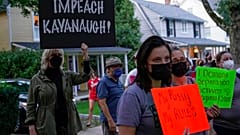Protesters gather outside the home of Supreme Court Justice Brett Kavanaugh