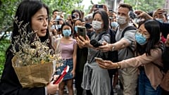 Zhou Xiaoxuan, a former intern at China's state broadcaster CCTV, speaks outside a courthouse on Sept. 14, 2021. 