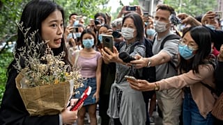Zhou Xiaoxuan, a former intern at China's state broadcaster CCTV, speaks outside a courthouse on Sept. 14, 2021. 