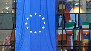 FILE: EU nations flags are mirrored in the windows of the EU Council headquarters ahead of a two-day EU summit in Brussels in March 2008