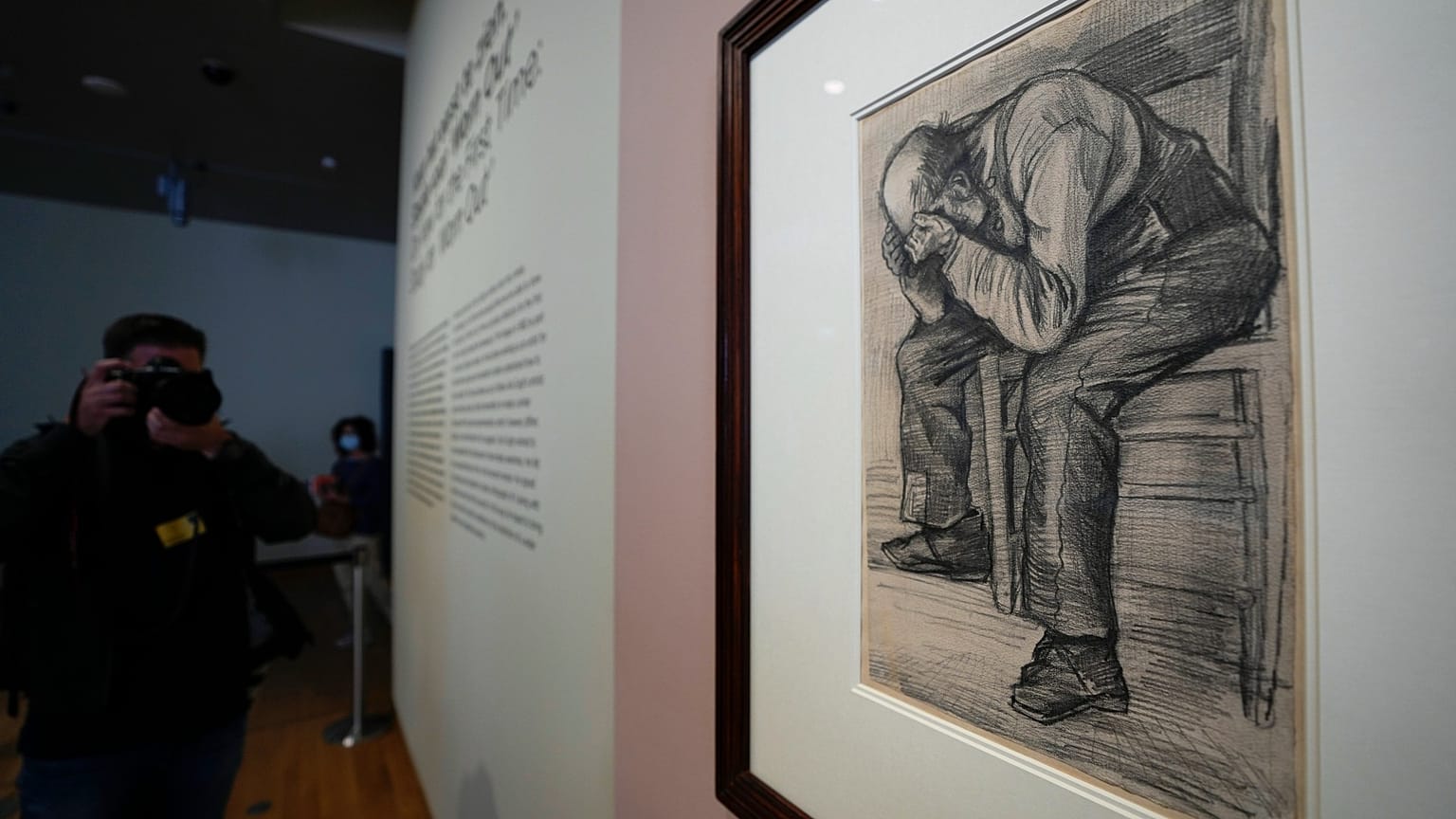 A photographer takes pictures of Study for "Worn Out", a drawing by Dutch master Vincent van Gogh, at the Van Gogh Museum in Amsterdam, Netherlands, Sept. 16, 2021. 