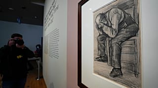 A photographer takes pictures of Study for "Worn Out", a drawing by Dutch master Vincent van Gogh, at the Van Gogh Museum in Amsterdam, Netherlands, Sept. 16, 2021. 