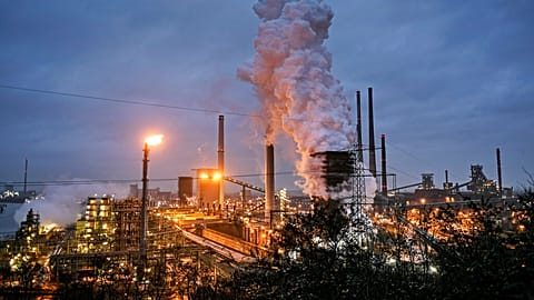 a ThyssenKrupp coking plant steams around the clock for the nearby steel mill in Duisburg, Germany. 