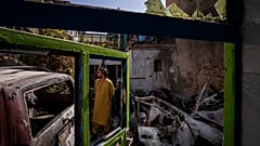An Afghan inspects the damage of Ahmadi family house in Kabul, Afghanistan, Monday, Sept. 13, 2021. 