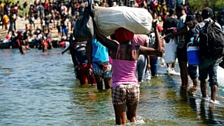 Haitian migrants use a dam to cross to and from the United States from Mexico, in Del Rio, Texas. 
