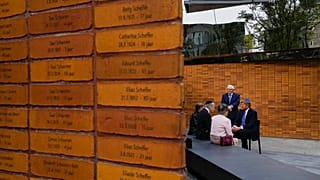  King Willem-Alexander, right, talks to Holocaust survivors and relatives after unveiling the new monument in Amsterdam's historic Jewish Quarter 