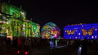 People gather on Bebelplatz for the "Festival of Lights" in Berlin, September, 2021.