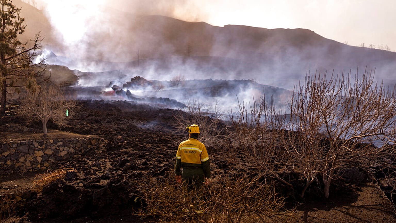 Ash and debris after an eruption of a volcano near El Paso on the island of La Palma in the Canaries, Spain, Tuesday, Sept. 21, 2021.