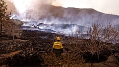 Ash and debris after an eruption of a volcano near El Paso on the island of La Palma in the Canaries, Spain, Tuesday, Sept. 21, 2021.