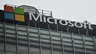 The Microsoft logo is seen at its local headquarters in Beijing on July 20, 2021.