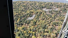 The Antonov AN-26 aircraft crashed in moutainous terrain.