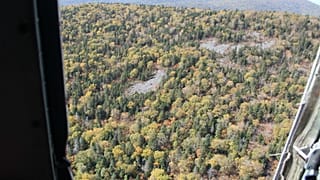 The Antonov AN-26 aircraft crashed in moutainous terrain.