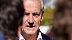 Norway’s Labour Party leader Jonas Gahr Store answers questions from the media outside his home in Oslo