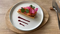 Smoked salmon tart with fresh herbs and beet sauce 