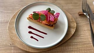 Smoked salmon tart with fresh herbs and beet sauce 