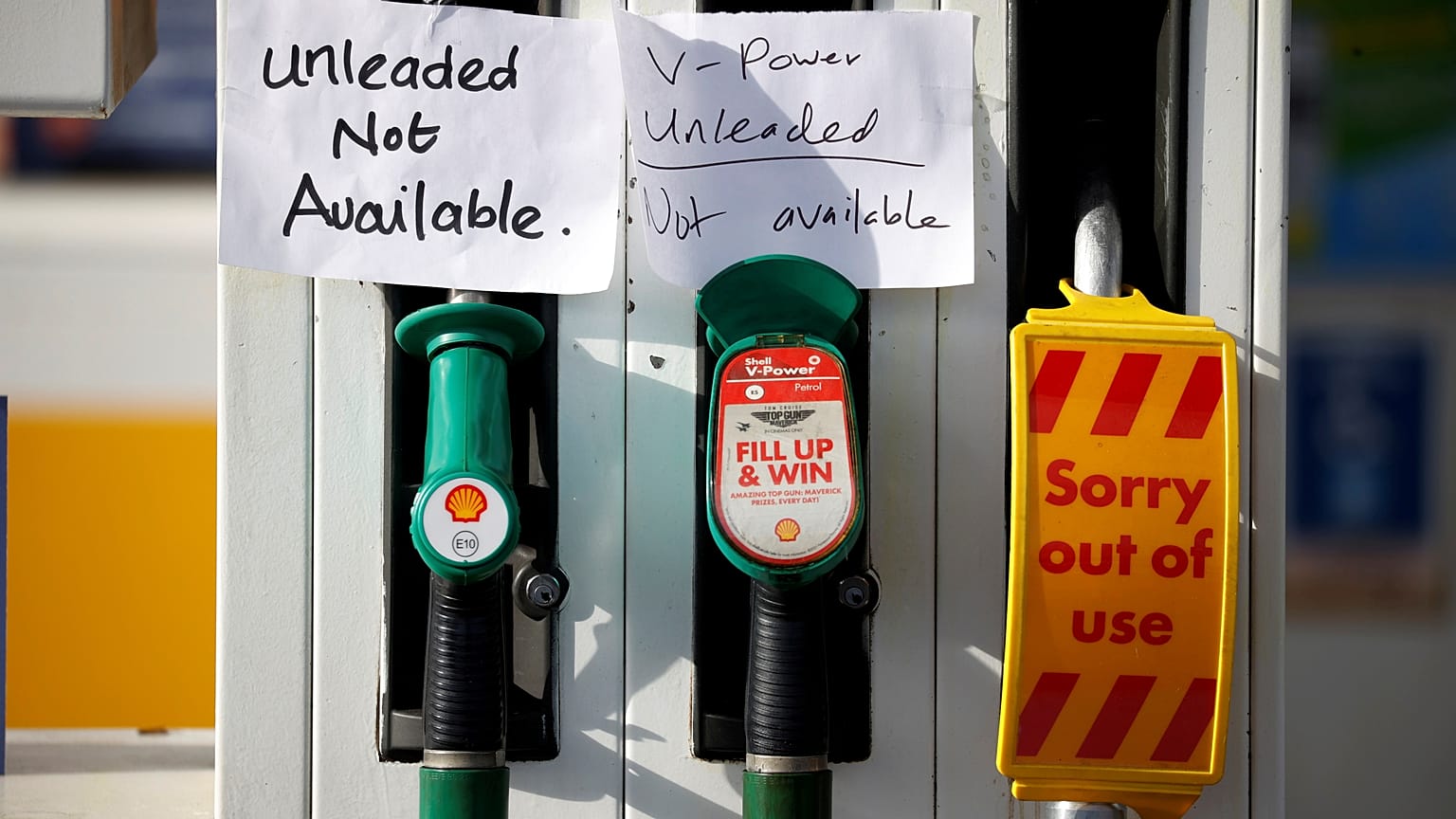 Hand written signs are stuck to a petrol pump with no fuel available at a Shell filling station in Manchester