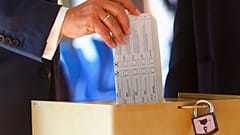 Armin Laschet, Christian Union parties candidate for Chancellery, casts his ballot for the German parliament election in Aachen, Germany, Sept. 26, 2021.