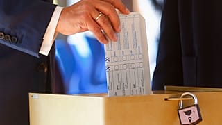 Armin Laschet, Christian Union parties candidate for Chancellery, casts his ballot for the German parliament election in Aachen, Germany, Sept. 26, 2021.