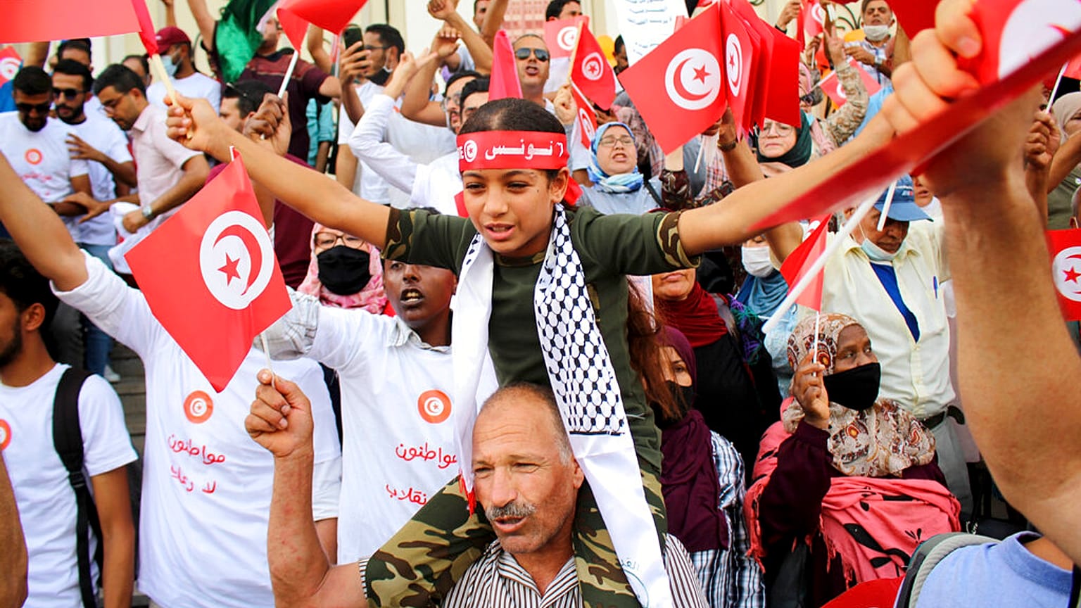 Demonstrators attend a protest against Tunisian President Kais Saied in Tunis on September 26