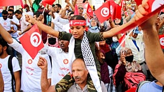 Demonstrators attend a protest against Tunisian President Kais Saied in Tunis on September 26