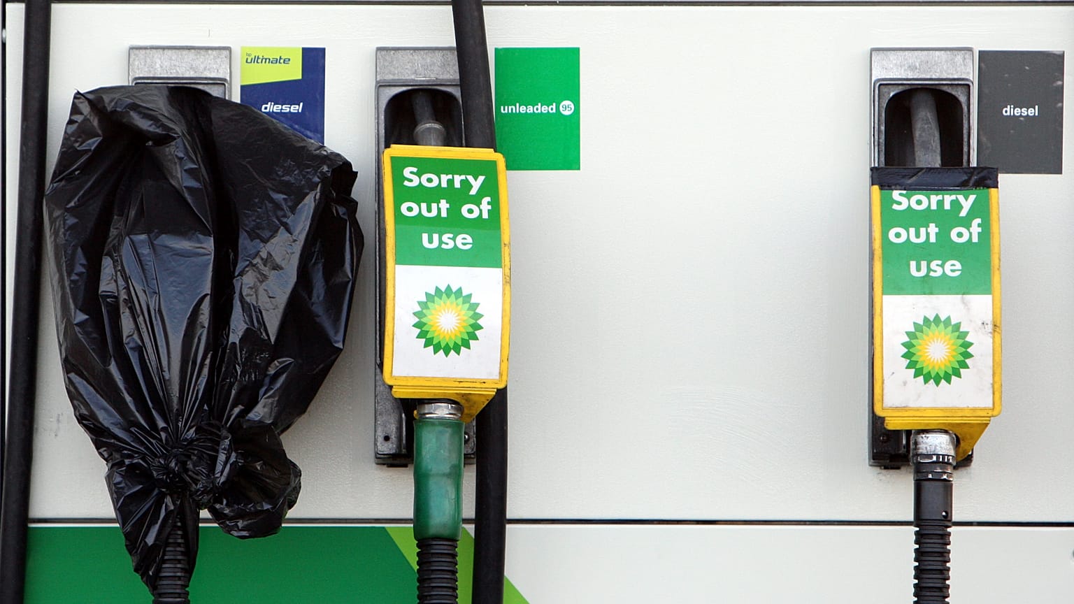A "sorry out of use', sign's are seen on fuel pump's at a gas station in Washington, England, March. 29, 2012.