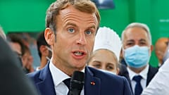 French President Emmanuel Macron speaks to attendees at the fair in Lyon.