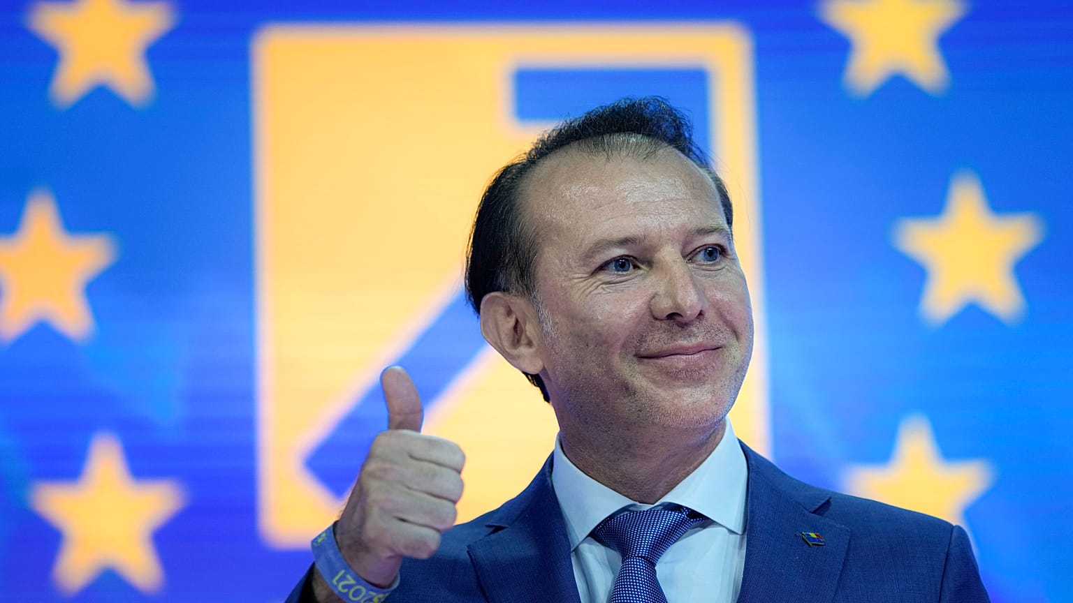 Romanian Prime Minister Florin Citu gives a thumbs up at the ruling Liberal Party congress in Bucharest.