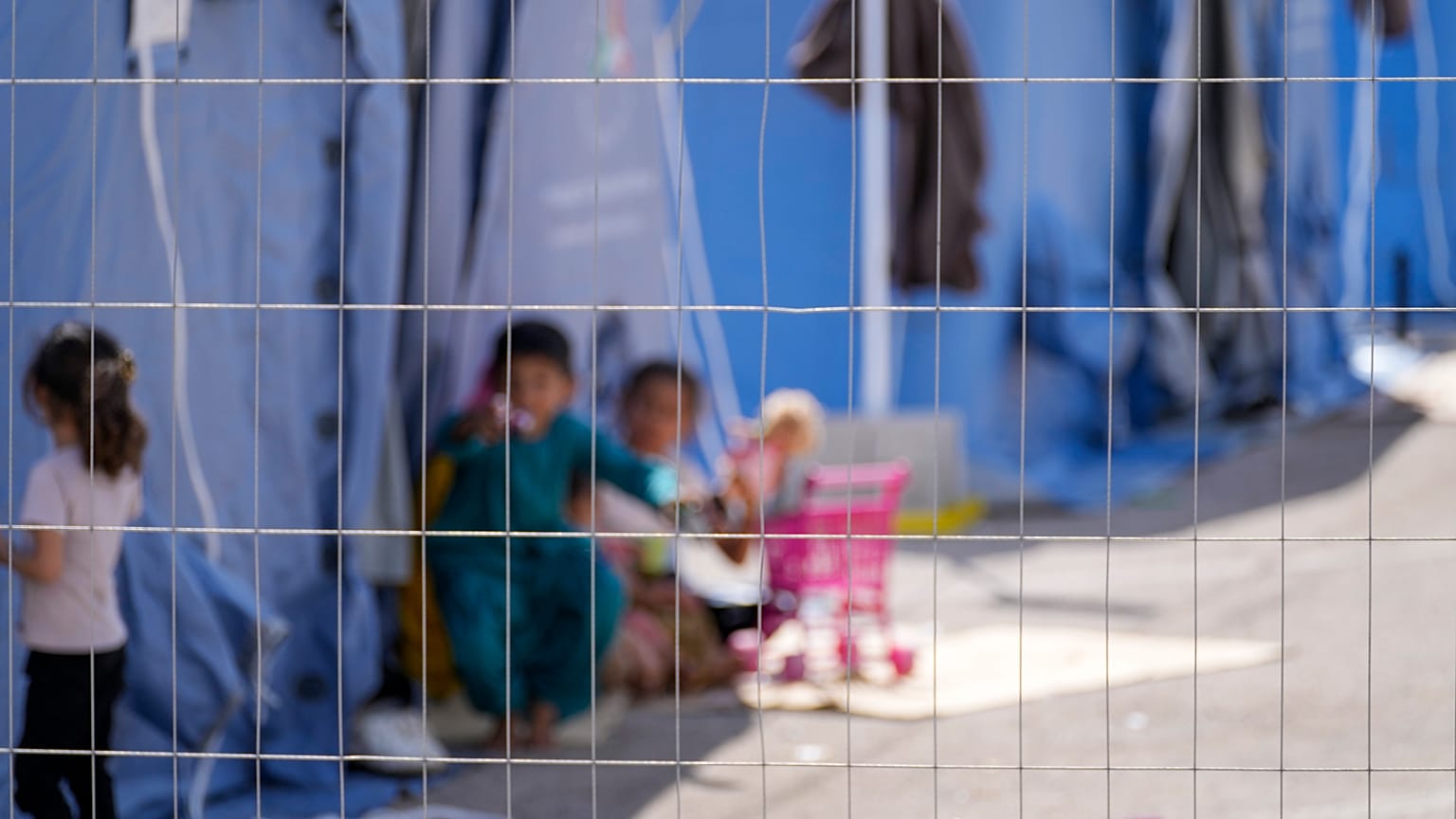 Afghan children play with toys in an Italian Red Cross refugee camp, in Avezzano, Italy, Tuesday, Aug. 31, 2021.