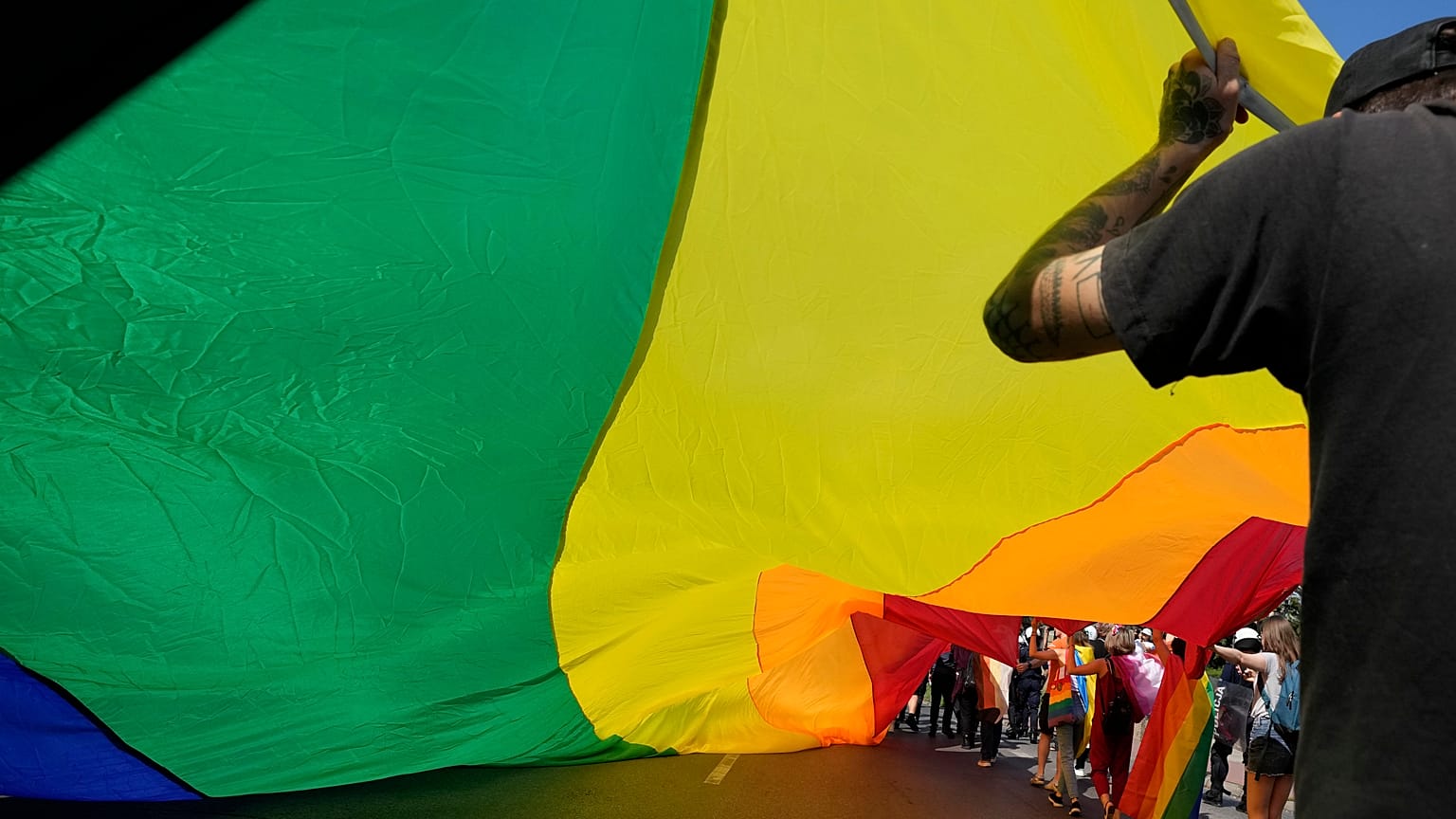 A rainbow flag is waved at a Pride march in the Polish city of Czestochowa.