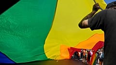 A rainbow flag is waved at a Pride march in the Polish city of Czestochowa.