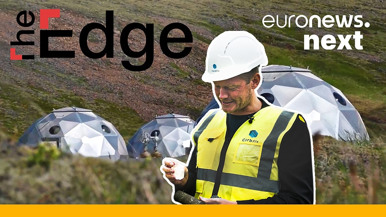 Tom Goodwin holds a stone made from C02 emissions.