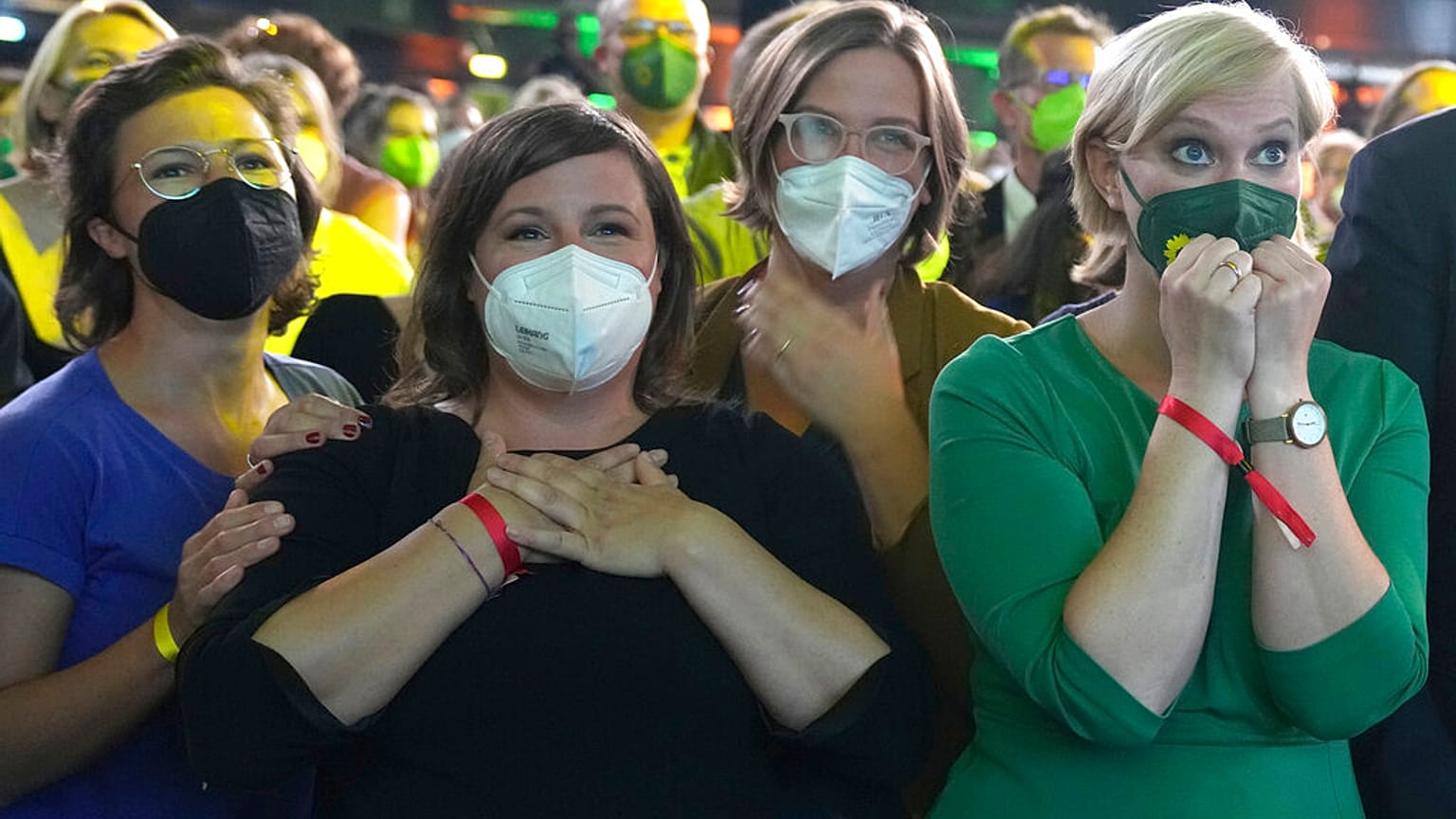 Guests at the election party of the Greens react after the publication of the first forecasts on the outcome of the 2021 federal election in Berlin, Sunday, Sept. 26, 2021