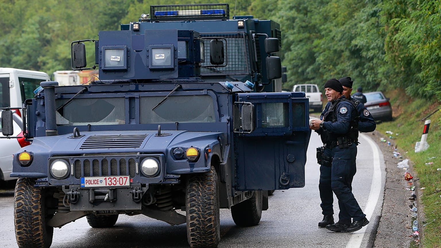Kosovo police secure the area as Ethnic Serbs gathered on barricades near the northern Kosovo border crossing of Jarinje on the ninth day of protest, Sept. 28, 2021