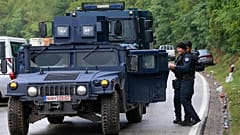 Kosovo police secure the area as Ethnic Serbs gathered on barricades near the northern Kosovo border crossing of Jarinje on the ninth day of protest, Sept. 28, 2021