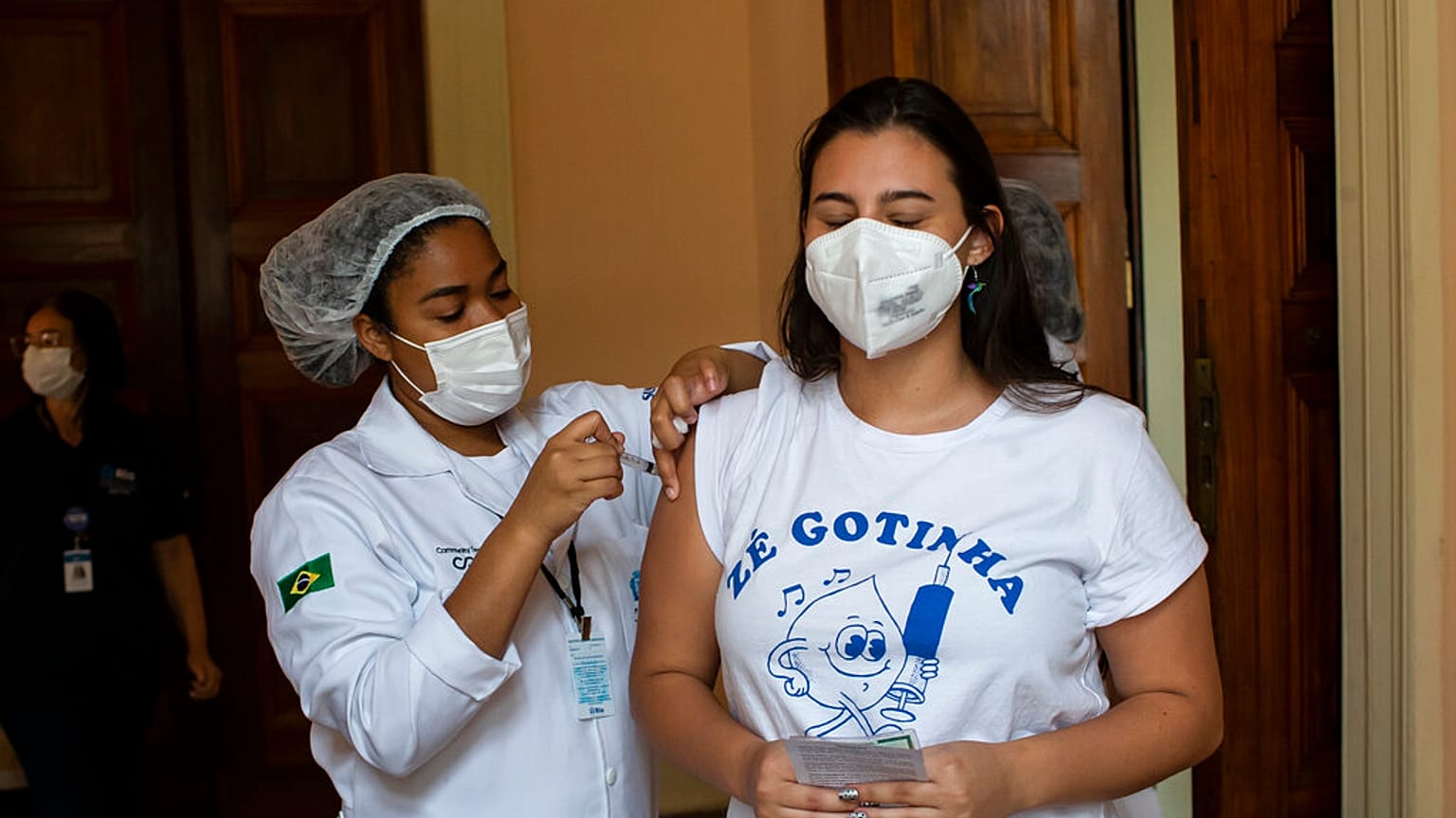Manuela Mattar is injected with a dose of the Pfizer COVID-19 vaccine, on the first day of a vaccination campaign for 17-year-olds, at a vaccination center in Rio de Janeiro