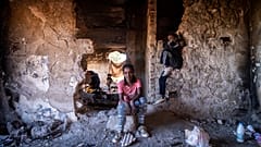 Sudanese girls sit inside an abandoned army outpost near Ieropigi village, northern Greece, at the Greek - Albanian border, on Saturday, Sept. 25, 2021.