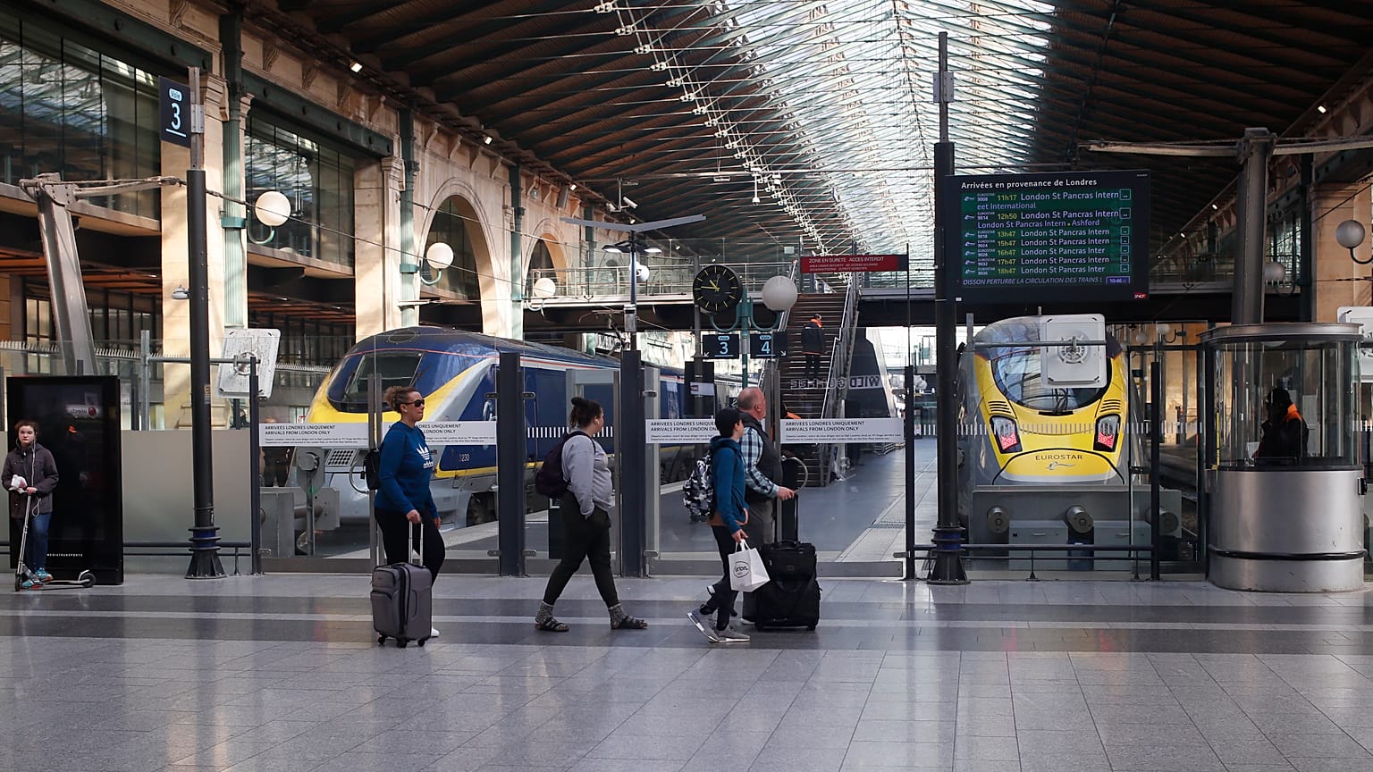 FILE: Travellers walk past Eurostar trains linking Paris to London, at the Gare du Nord station Thursday, March 21, 2019 in Paris.