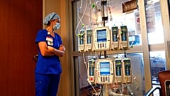 Nursing coordinator Beth Springer looks into a patient's room in a COVID-19 ward at the Willis-Knighton Medical Center in Shreveport, Louisiana. .