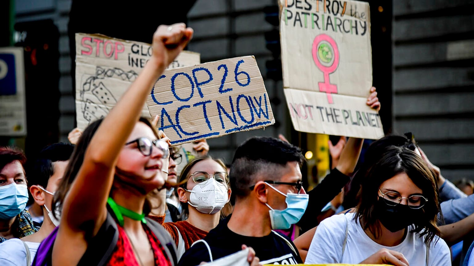 People take down to the streets in the wake of the three-day Youth for Climate summit, in Milan, Italy, Saturday, Oct. 2, 2021.