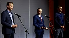 CDU's Paul Ziemiak, FDP's Volker Wissing & CSU's Markus Blume speak to the media following coalition talks, in Berlin on October 3, 2021.