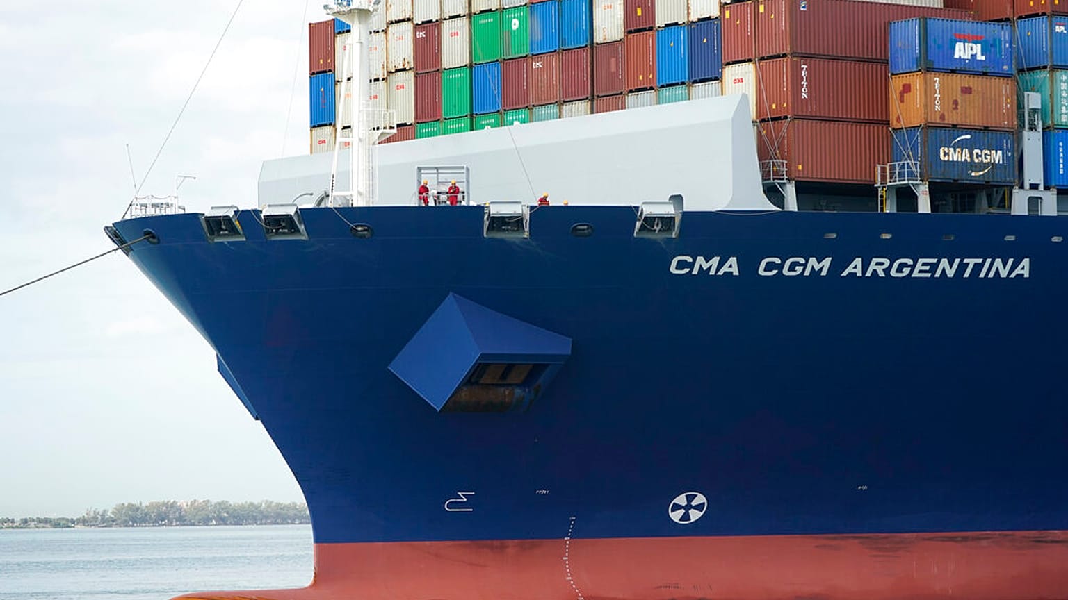 In this April 6, 2021 photo, crew members stand on the bow as the CMA CGM Argentina arrives at PortMiami, the largest container ship to call at a Florida port in Miami
