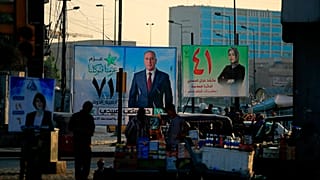 Campaign posters for the upcoming parliamentary elections are displayed in Baghdad on Sunday.