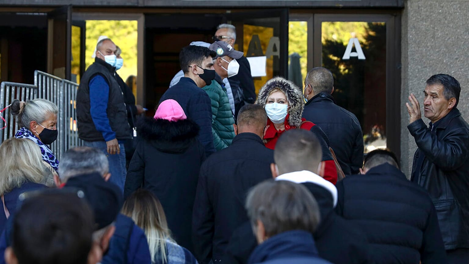 People queue for COVID-19 vaccinations in Sarajevo, Bosnia, where distrust in the government has fuelled vaccine hesitancy