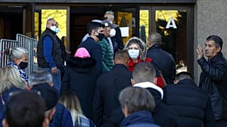People queue for COVID-19 vaccinations in Sarajevo, Bosnia, where distrust in the government has fuelled vaccine hesitancy