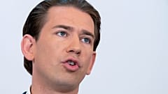 In this file photo taken on September 08, 2021 Austrian Chancellor Sebastian Kurz addresses a press conference .